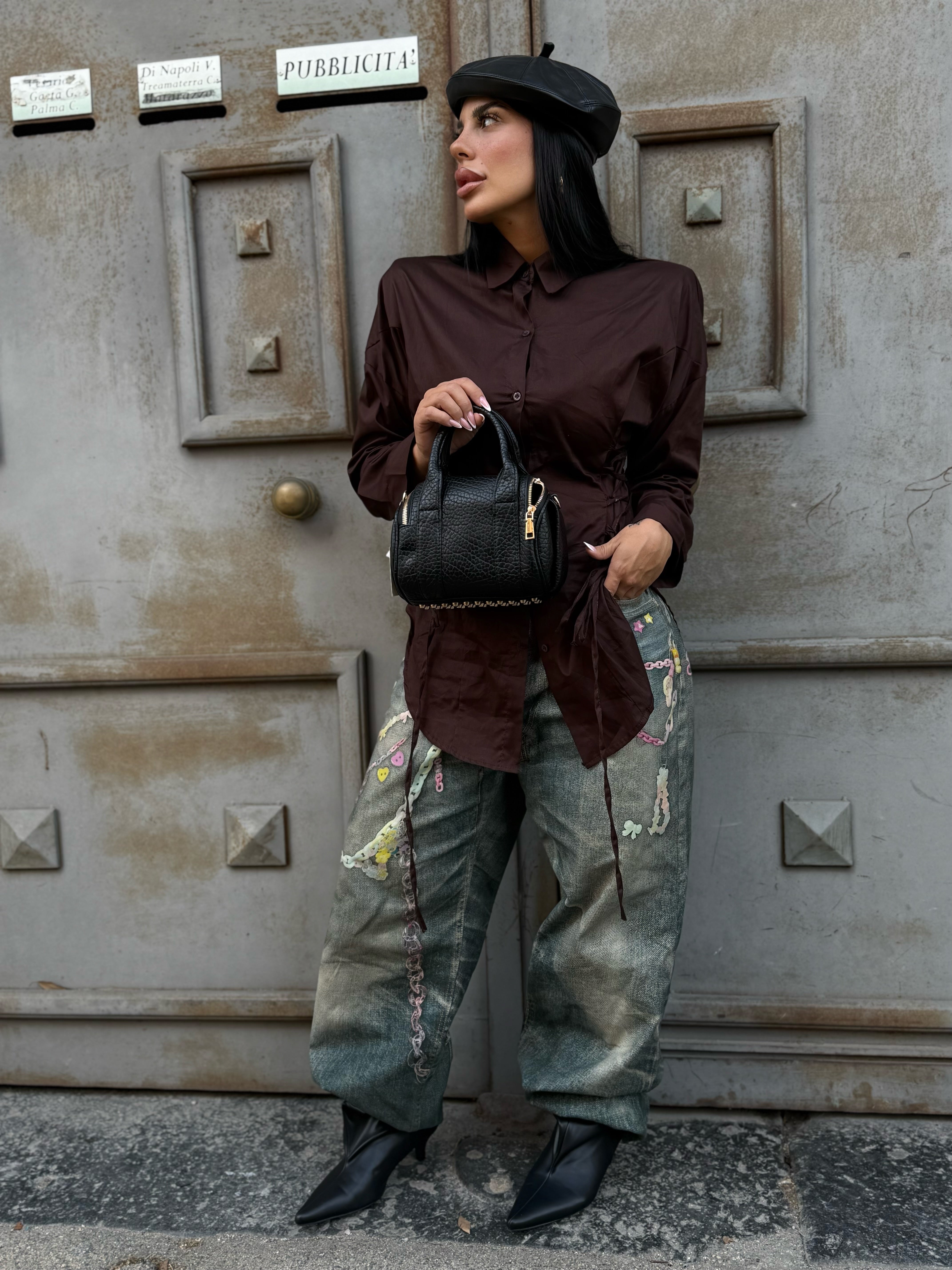 Borsetta in pelle con borchie