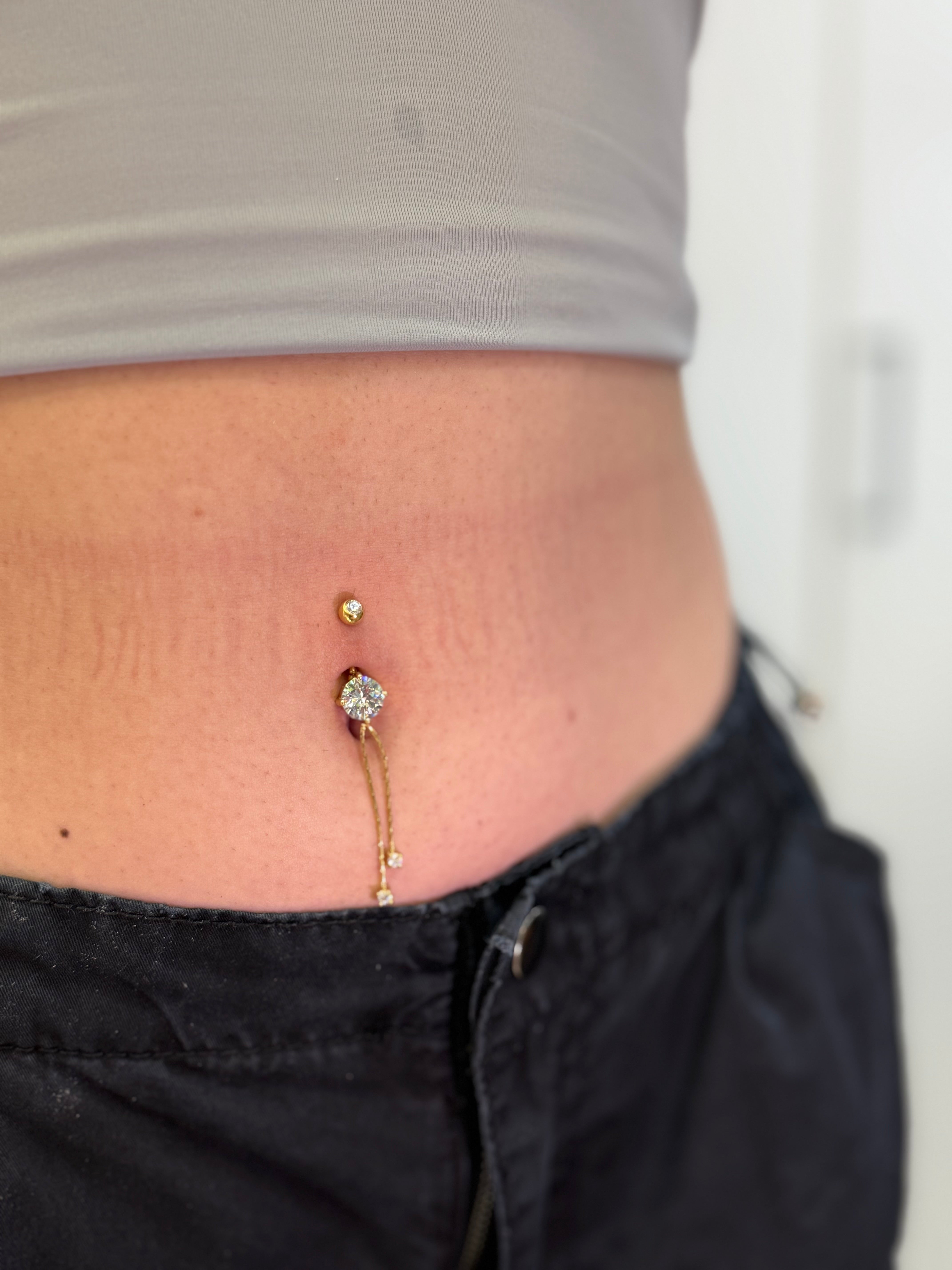 Piercing Ombelico punto luce
